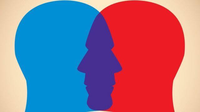 Duas sombras de pessoas, uma azul e uma vermelha se encarando, demonstrando a polarização.